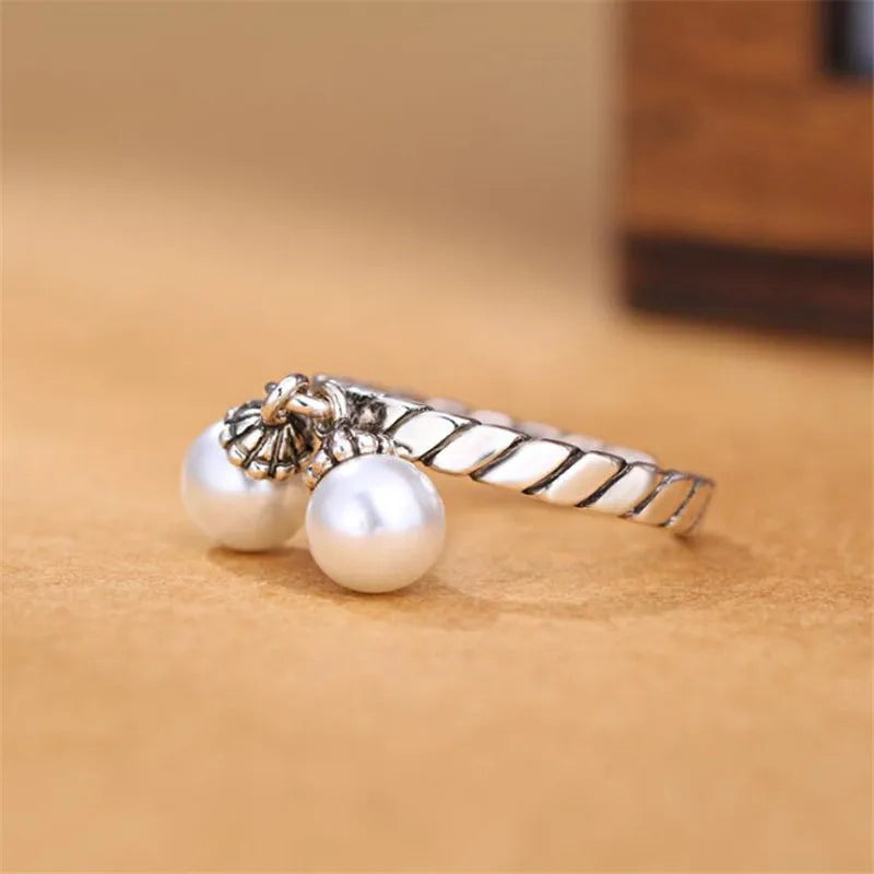 Silver Pearl Twist Ring – Elegant, retro, and adjustable.