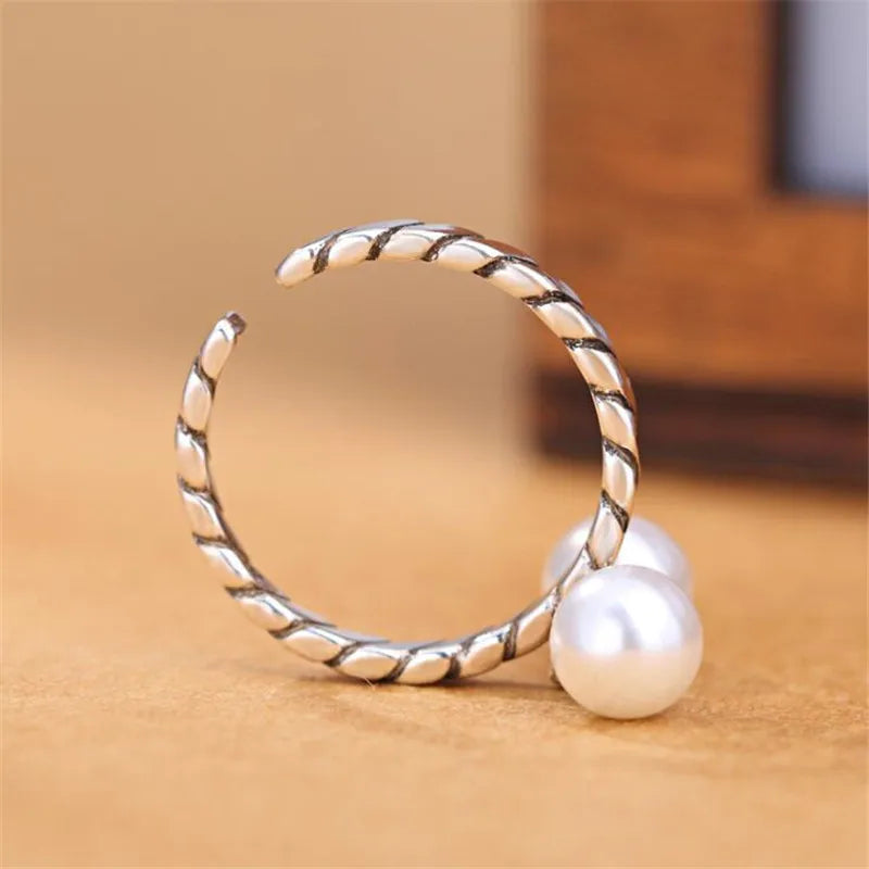 Silver Pearl Twist Ring – Elegant, retro, and adjustable.